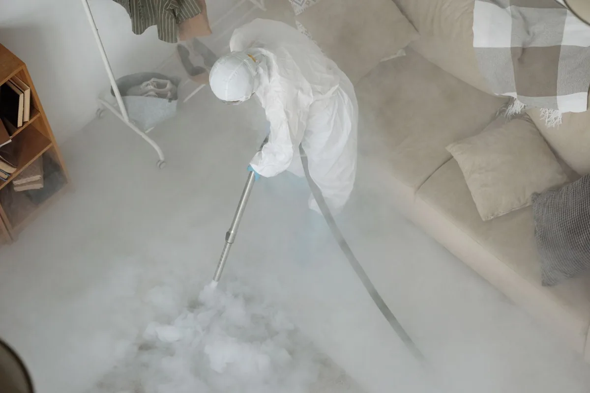 Biohazard cleanup technician in protective equipment, Sonora, CA